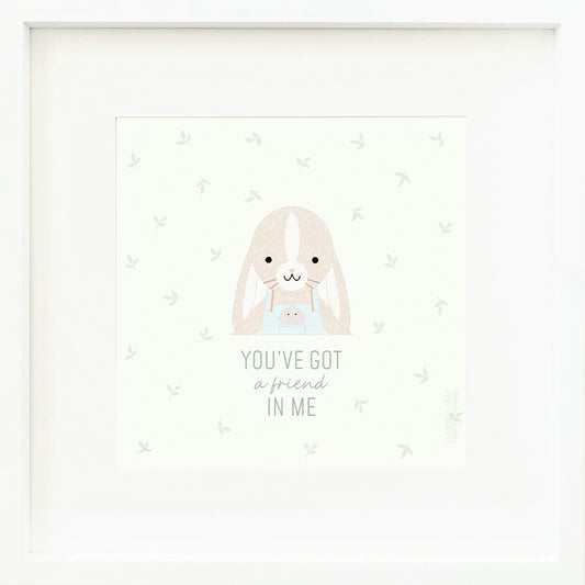 An inspirational print with a graphic of Briar the bunny on a white background with a green leaf print and the words “You’ve got a friend in me” in green text.