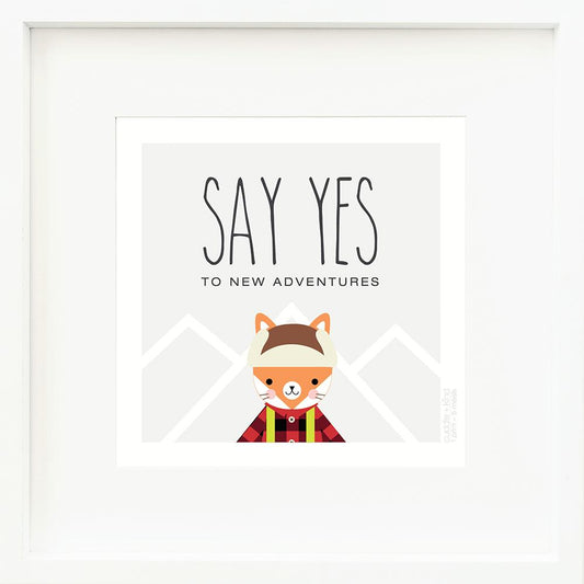 An inspirational print with a graphic of Wyatt the fox on a gray background with mountain peaks outlined in white and the words “Say yes to new adventures” in black.